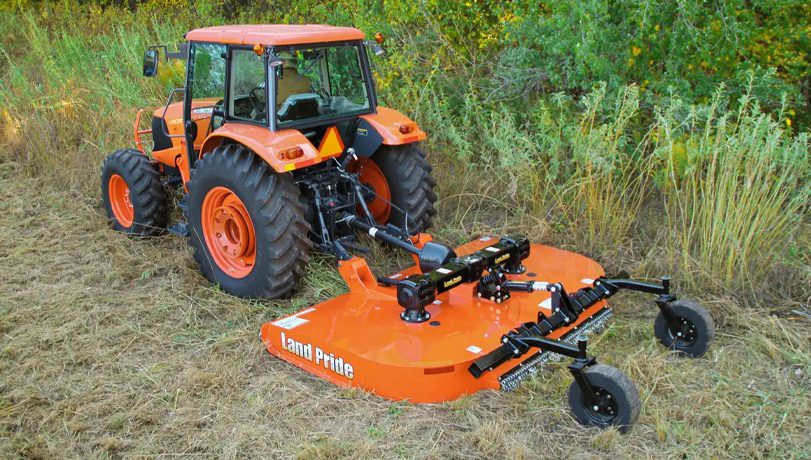New Land Pride RCF3610 Series Rotary Cutters attached to Kubota tractor clearing a field.