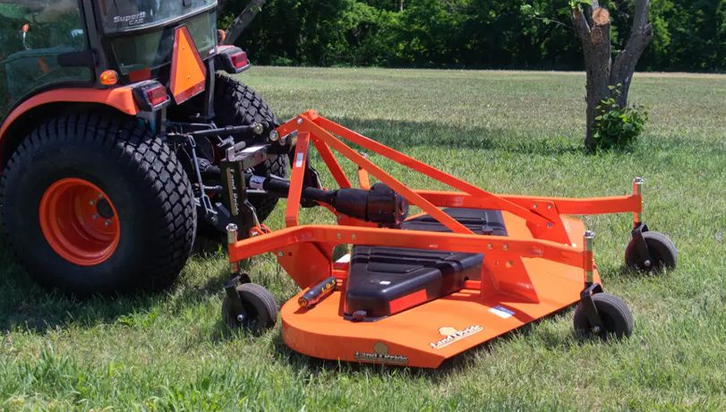 New Land Pride FDR25 Series Grooming Mowers on a green field attached to a Kubota tractor.