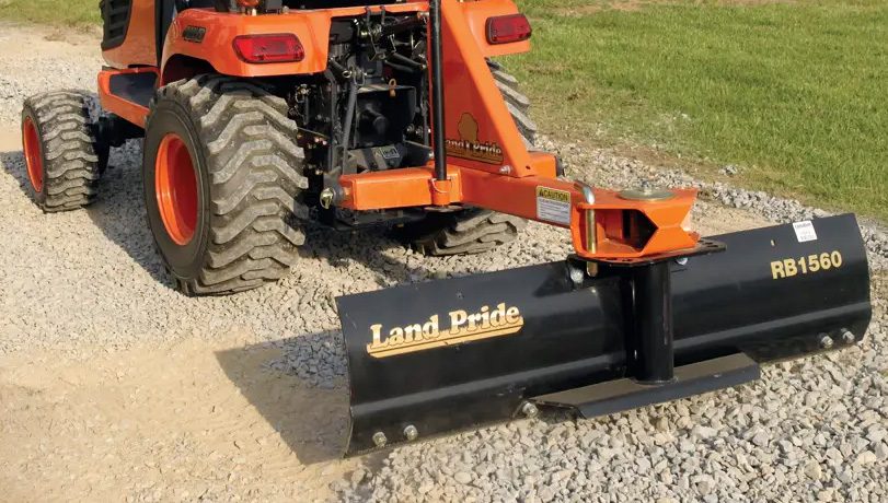 Kubota tractor with a Land Pride RB15 Series Rear Blade attached to the back.