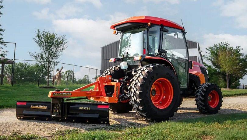 Kubota tractor with a Land Pride RB37 Series Rear Blade attached to the back.