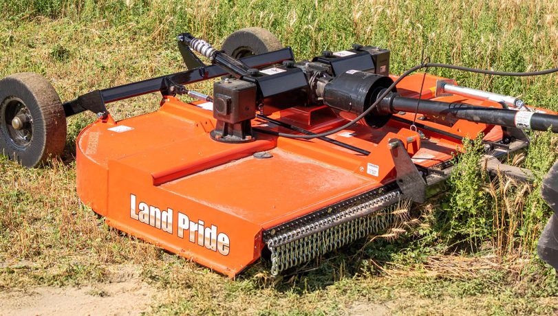 Land Pride RCR2596/RCR2510 Rotary Cutters trimming grass in a field.